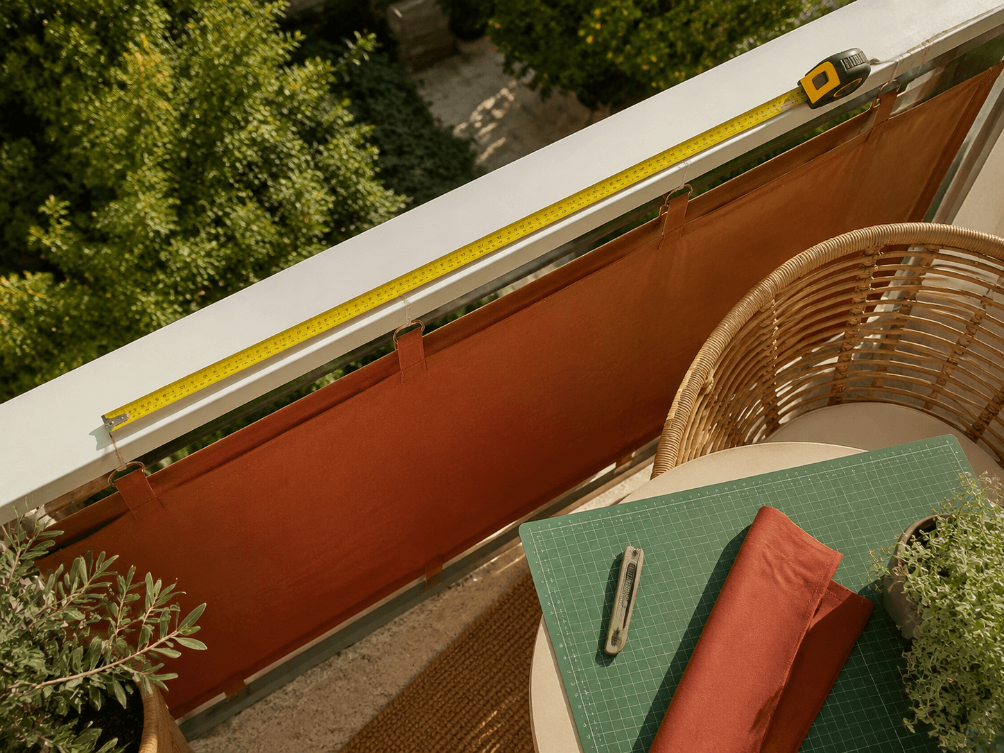 Measuring a balcony rail before selecting screening